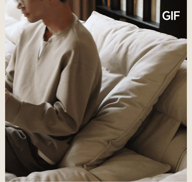 Contemporary suede fabric modular chaise 1 seater sofa bloom in still life.