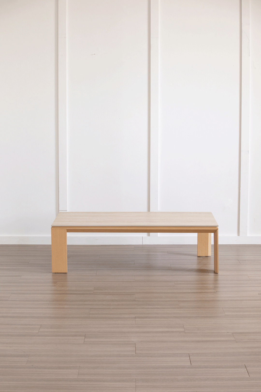Minimalist ash wood veneer sintered stone coffee table string color swatches.