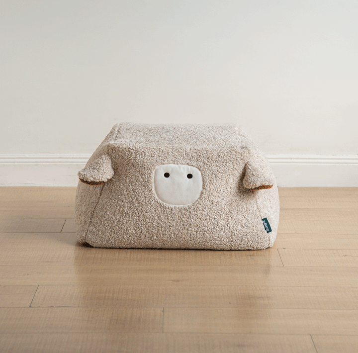 Cream boucle fabric ottoman sheep color swatches.