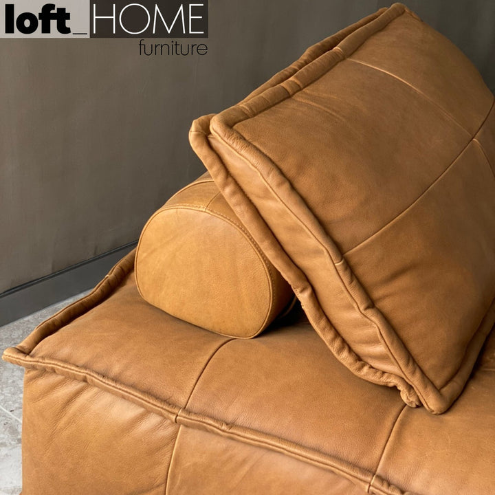 Vintage genuine leather 1 seater sofa element single in panoramic view.