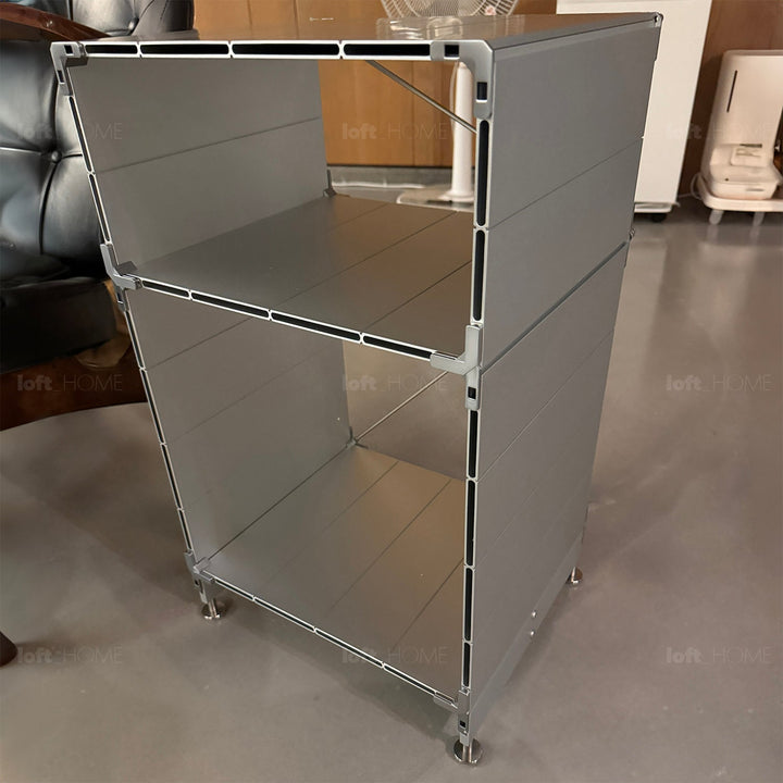 Industrial aluminium side table cube in close up details.