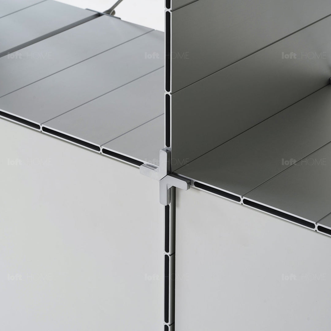 Industrial aluminium wheeled trolley side table cube in still life.