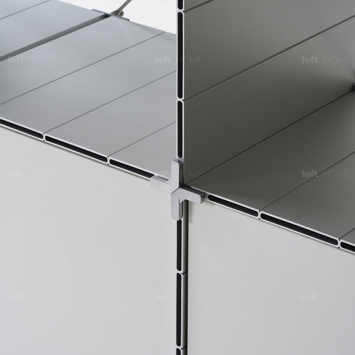 Industrial aluminium wheeled trolley side table cube in still life.