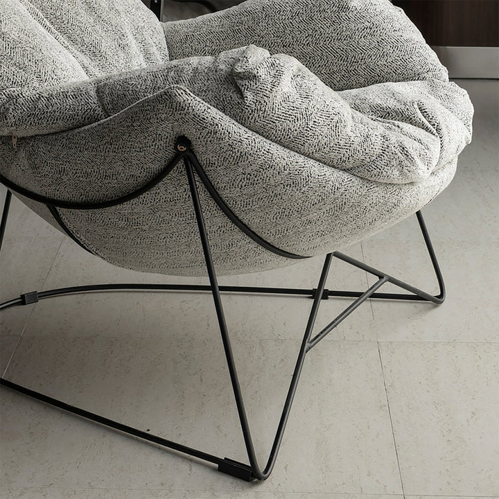 Industrial mixed weave fabric 1 seater sofa chair pomp in close up details.