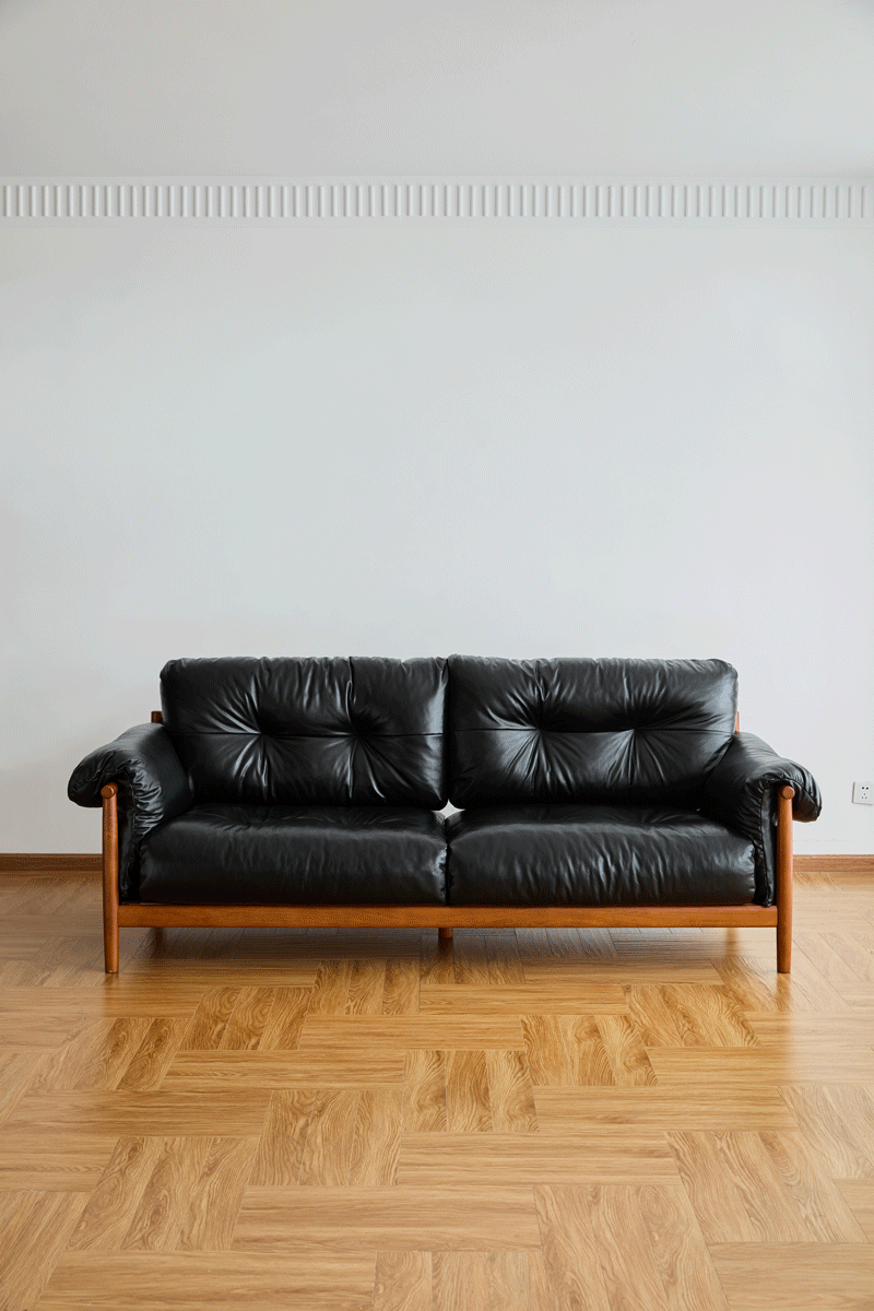 Bauhaus chenille velvet fabric boxwood 3 seater sofa open backed in still life.