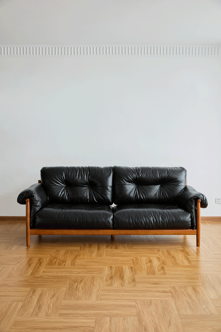 Bauhaus chenille velvet fabric boxwood 3 seater sofa open backed in still life.