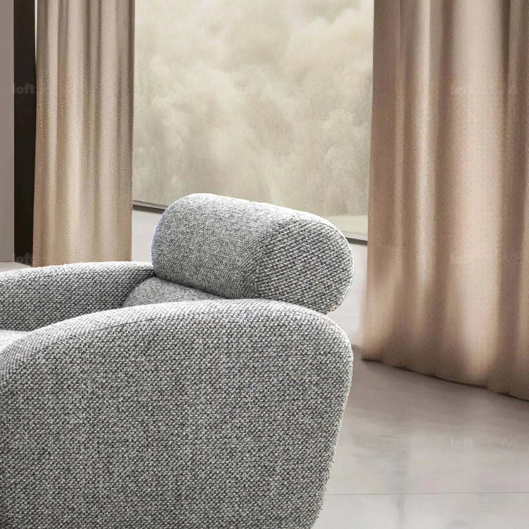 Modern mixed weave fabric 1 seater sofa monolithe in still life.
