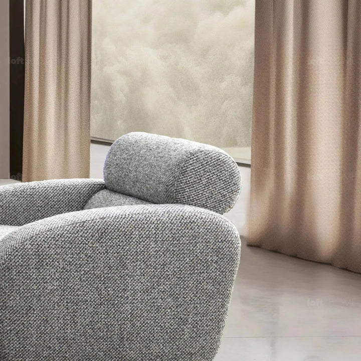 Modern mixed weave fabric 1 seater sofa monolithe in still life.