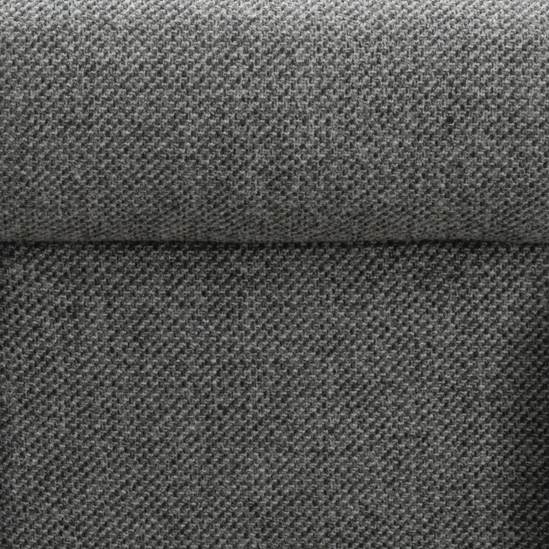 Modern mixed weave fabric 1 seater sofa monolithe in close up details.