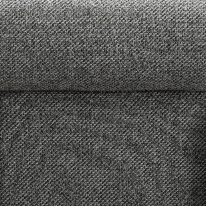 Modern mixed weave fabric 1 seater sofa monolithe in close up details.