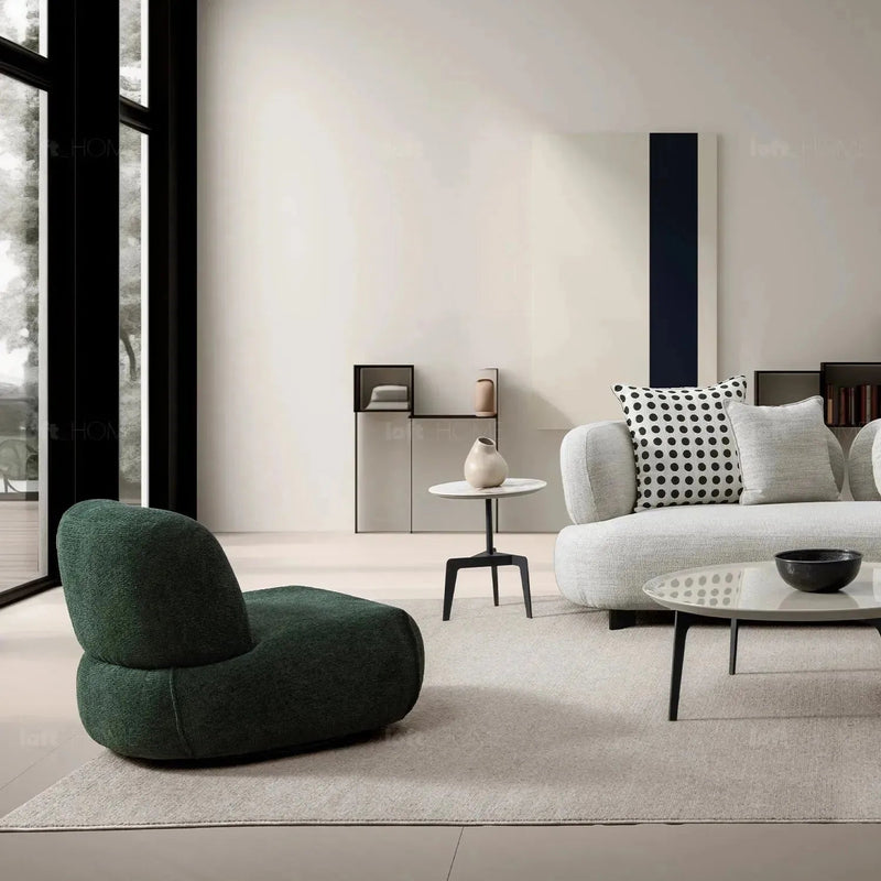 Cream mixed weave fabric revolving 1 seater sofa moss in close up details.