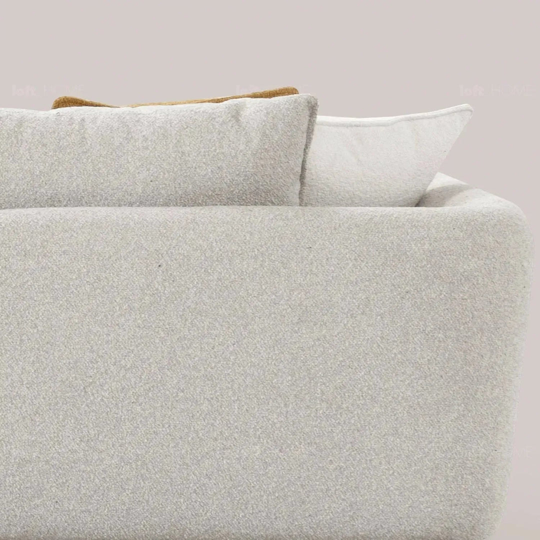 Modern fabric 4 seater sofa angler in close up details.