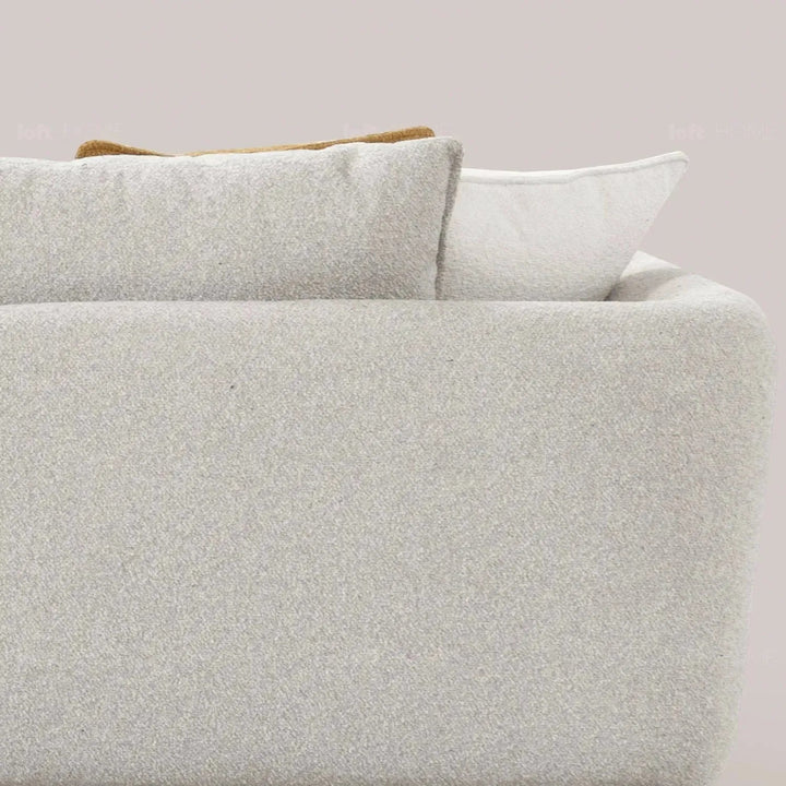 Modern fabric 4 seater sofa angler in close up details.