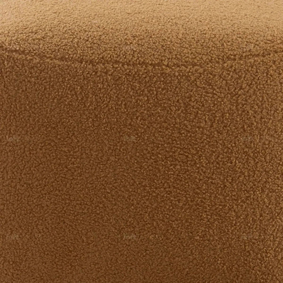 Cream sherpa fabric ottoman saffron in panoramic view.