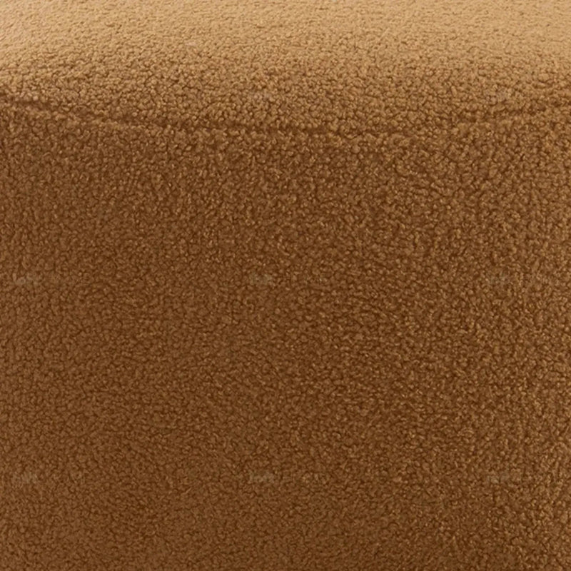 Cream sherpa fabric ottoman saffron in panoramic view.