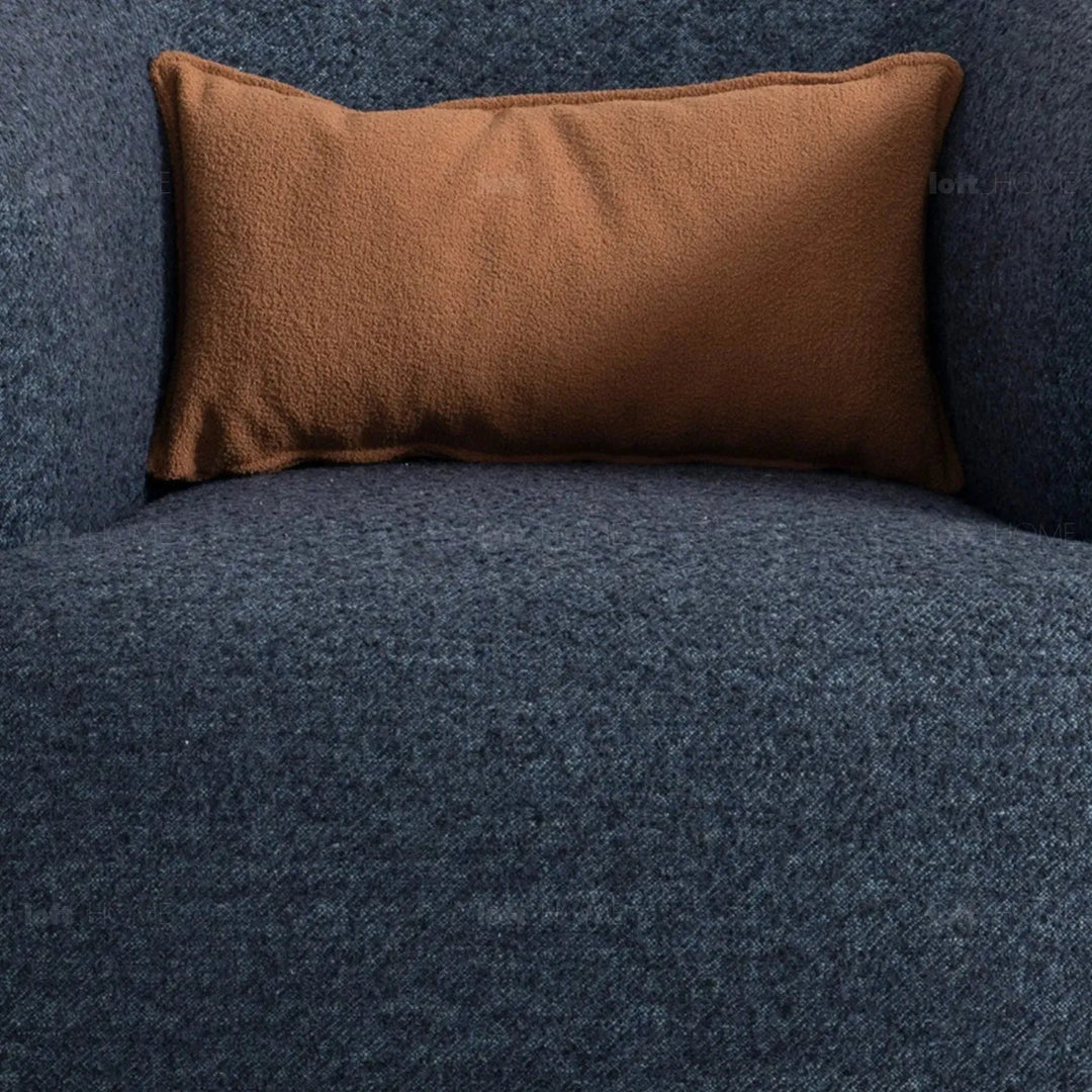 Cream boucle fabric revolving 1 seater sofa vance in close up details.