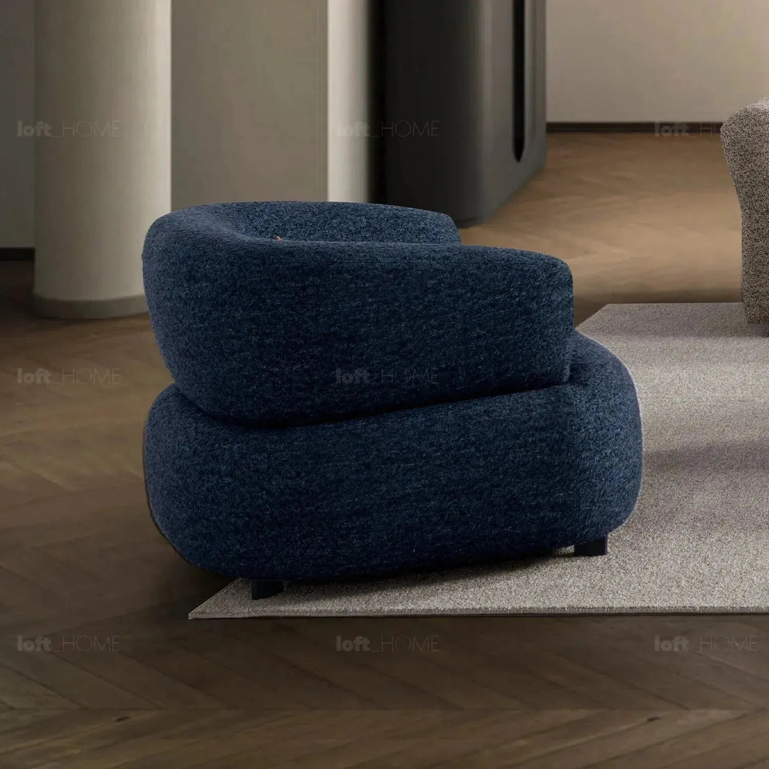 Cream boucle fabric revolving 1 seater sofa vance in details.