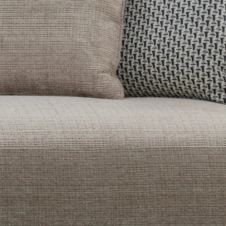 Modern mixed weave fabric 4 seater sofa ense in panoramic view.