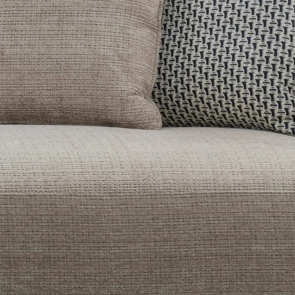 Modern mixed weave fabric 4 seater sofa ense in panoramic view.