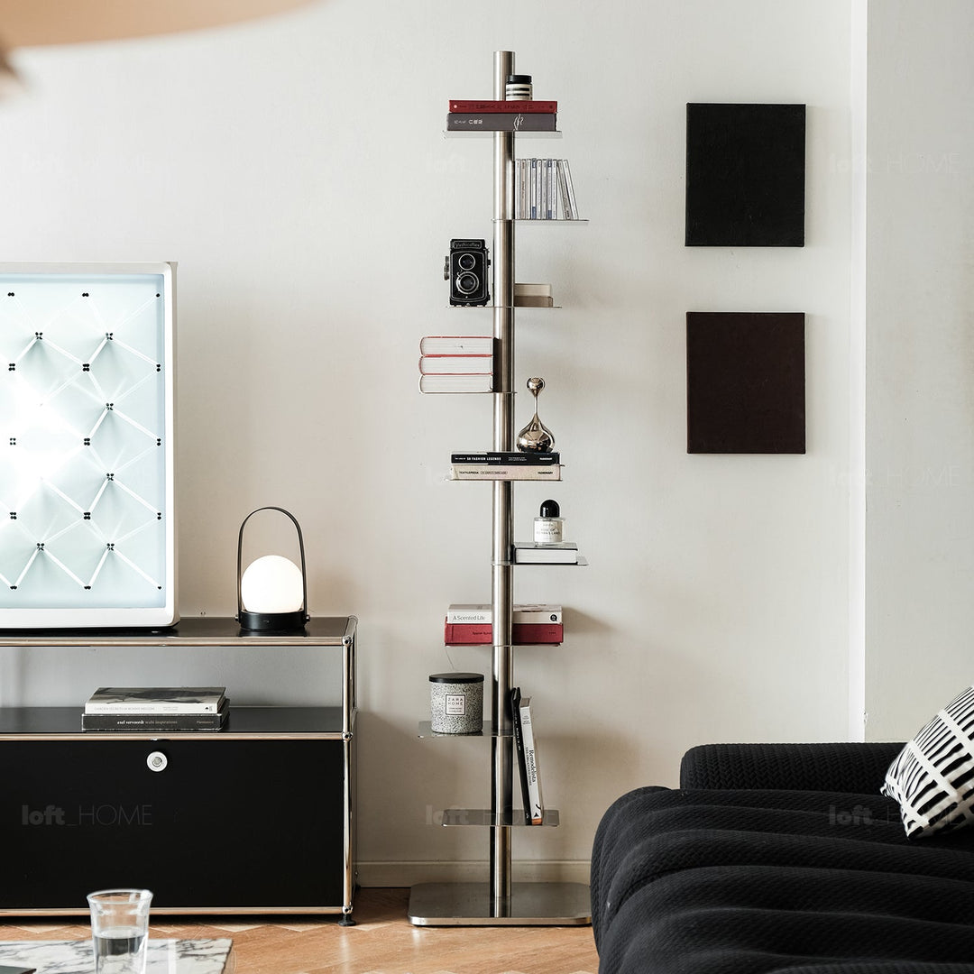 Minimalist steel revolving bookshelf stack in close up details.