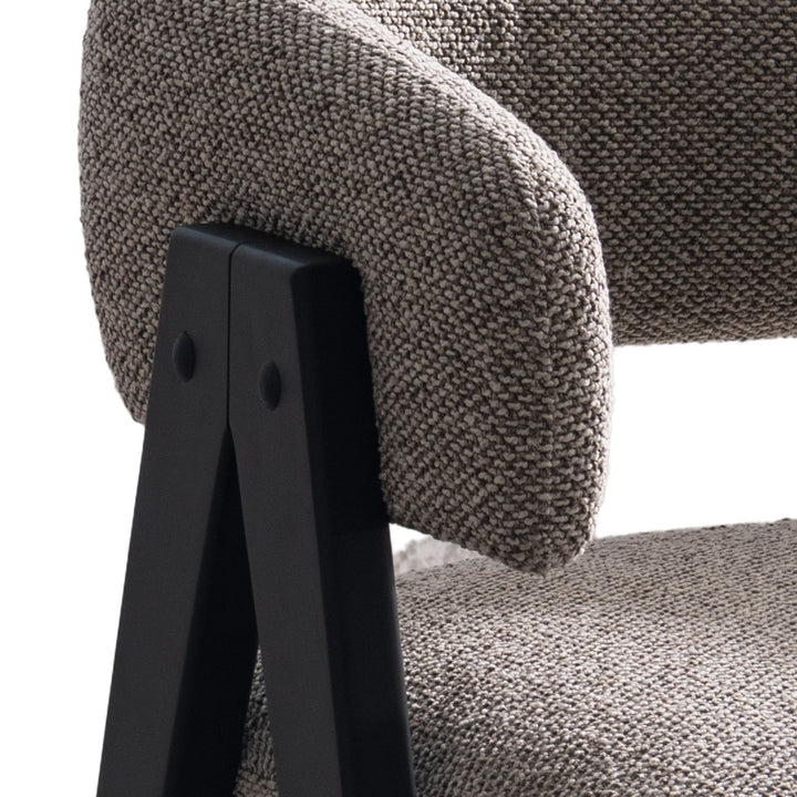 Japandi boucle fabric 1 seater sofa colle in close up details.