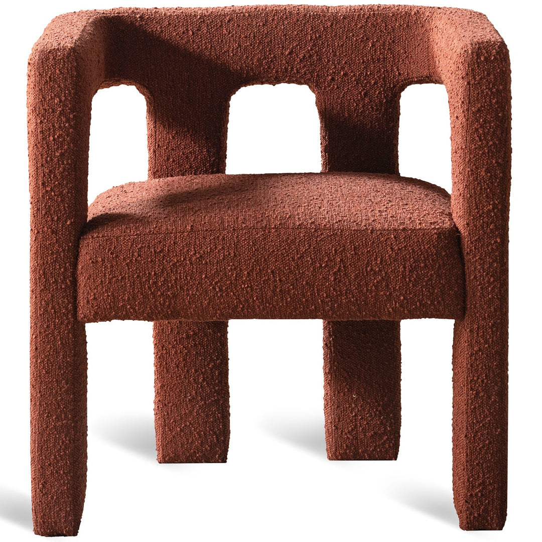 Bauhaus boucle fabric dining chair sienna in white background.