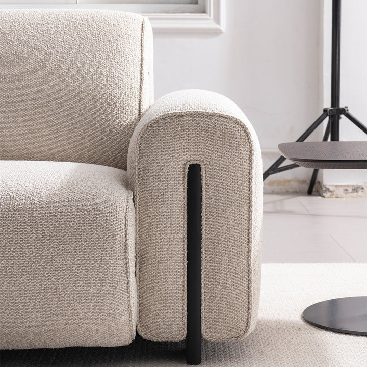 Minimalist boucle fabric modular 3 seater sofa colle in panoramic view.