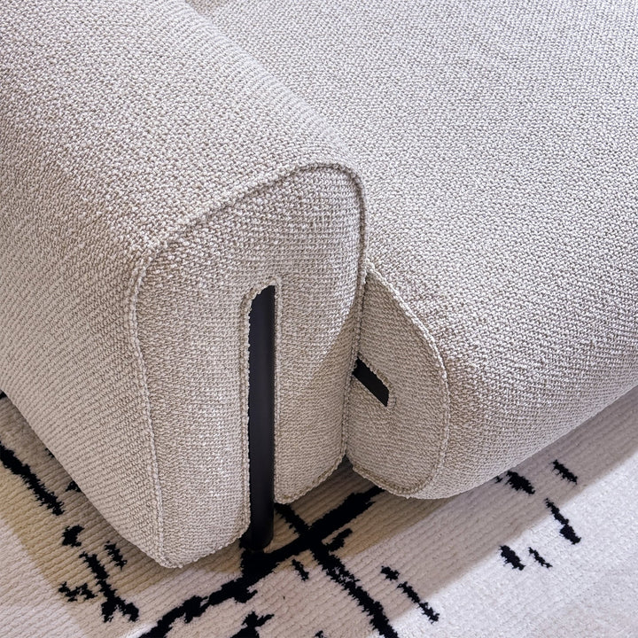 Minimalist boucle fabric modular corner 1 seater sofa colle in panoramic view.