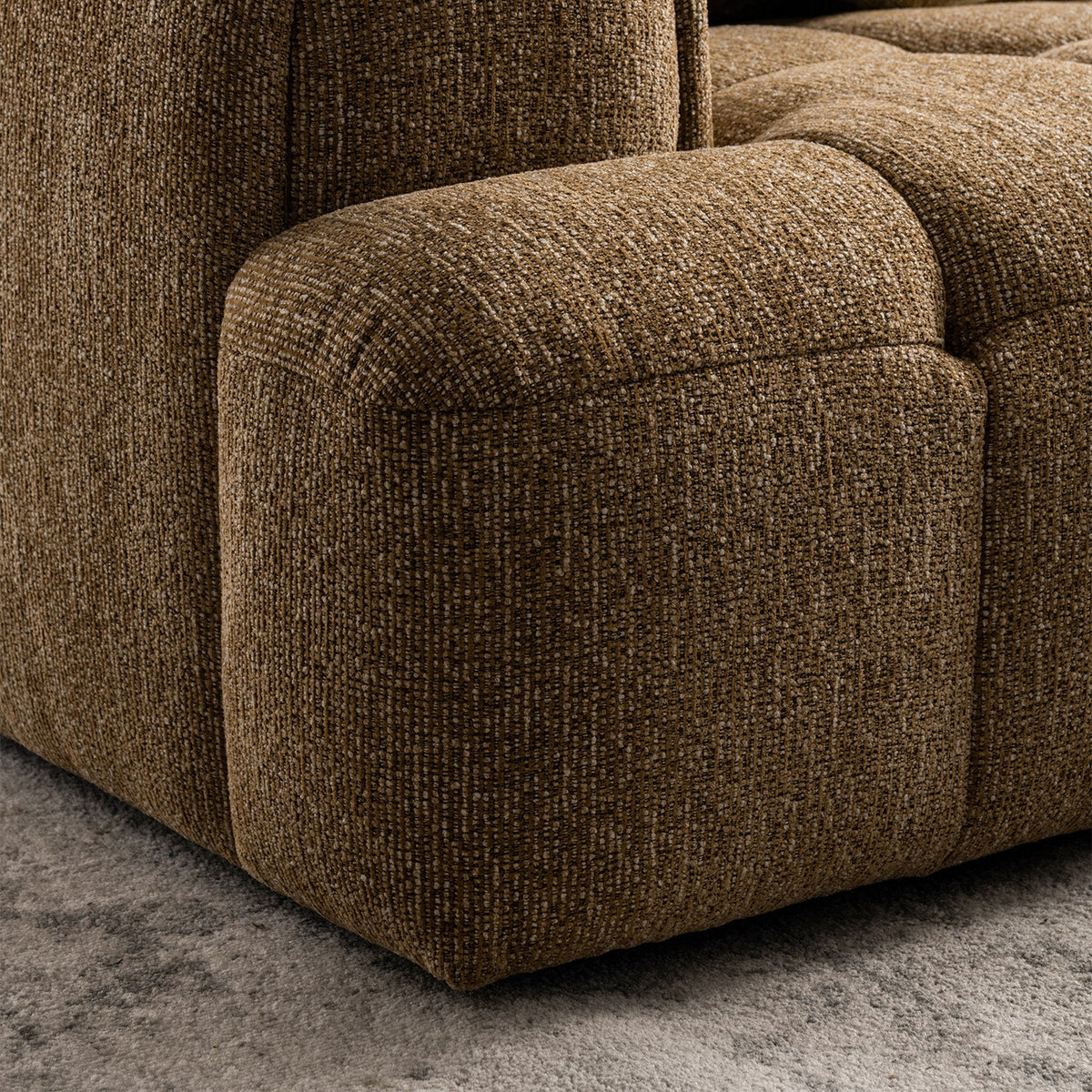 Modern mixed weave fabric 3 seater sofa puff with context.