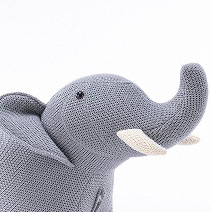 Contemporary mixed weave fabric ottoman decoration elephant in panoramic view.