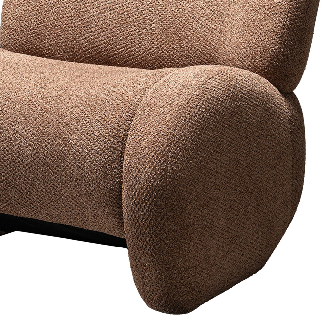 Cream sherpa fabric fabric 1 seater sofa boulder with context.