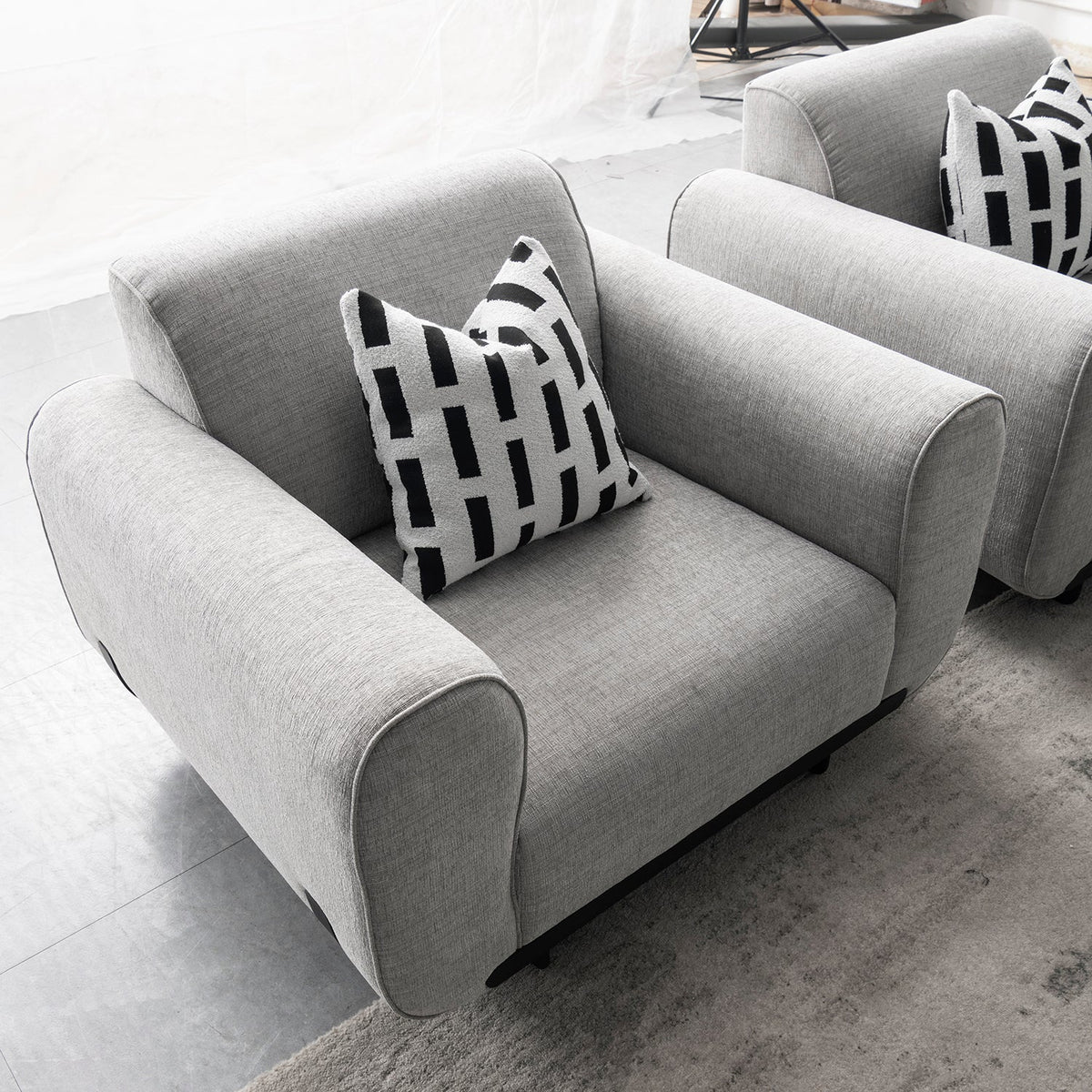 Modern mixed weave fabric 1 seater sofa griddy in real life style.