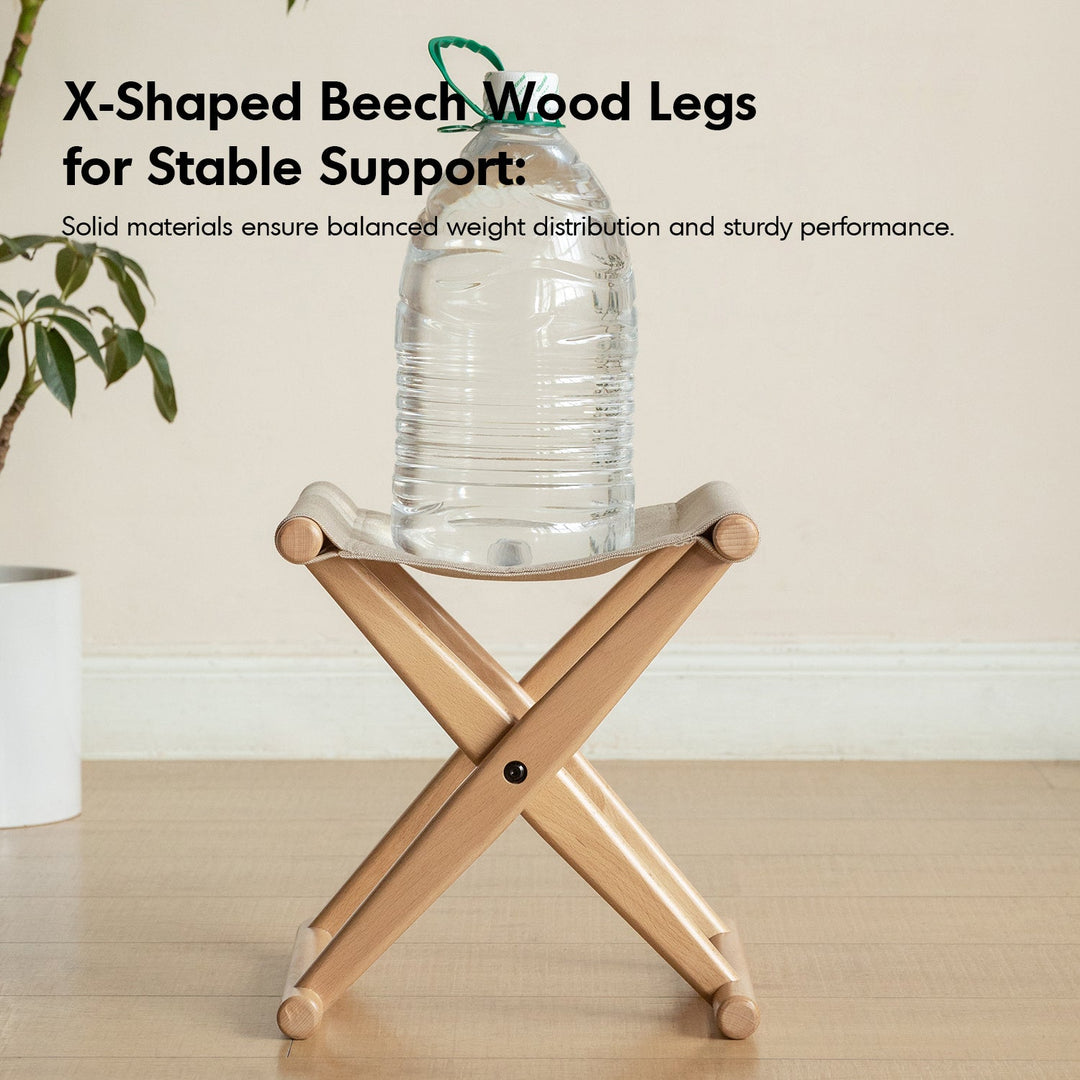 Scandinavian beech wood canvas folding stool kaya in still life.