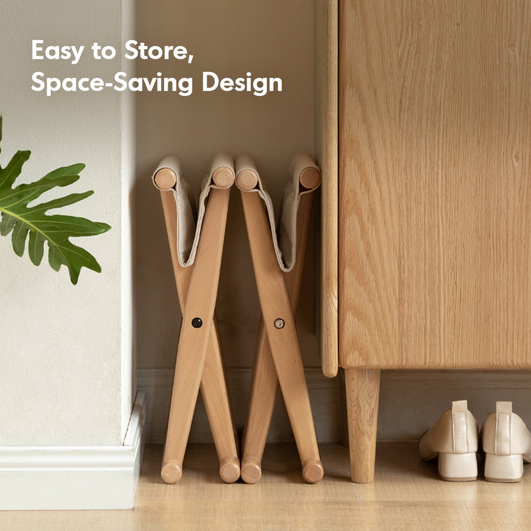 Scandinavian beech wood canvas folding stool kaya with context.