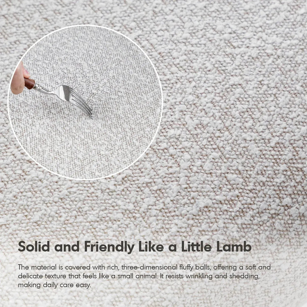 Cream boucle fabric dining chair whim in panoramic view.