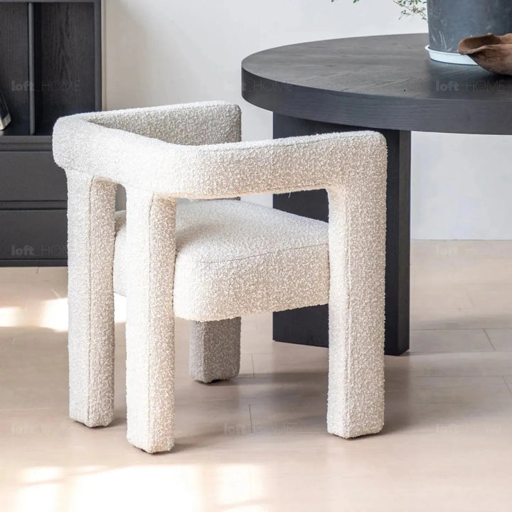 Bauhaus boucle fabric dining chair whim layered structure.