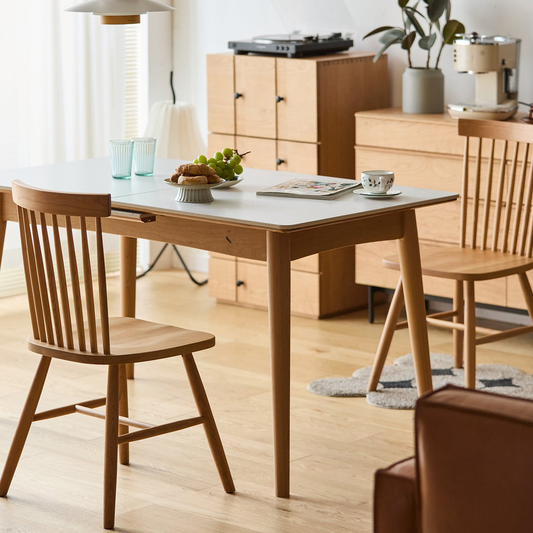 Scandinavian cherry wood dining chair windsor in panoramic view.