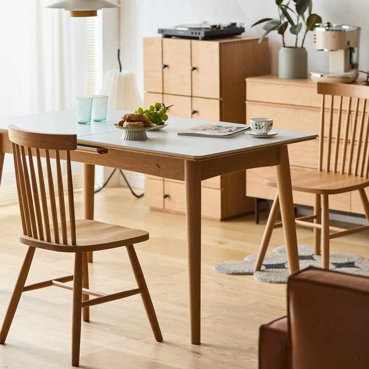 Scandinavian cherry wood dining chair windsor in panoramic view.