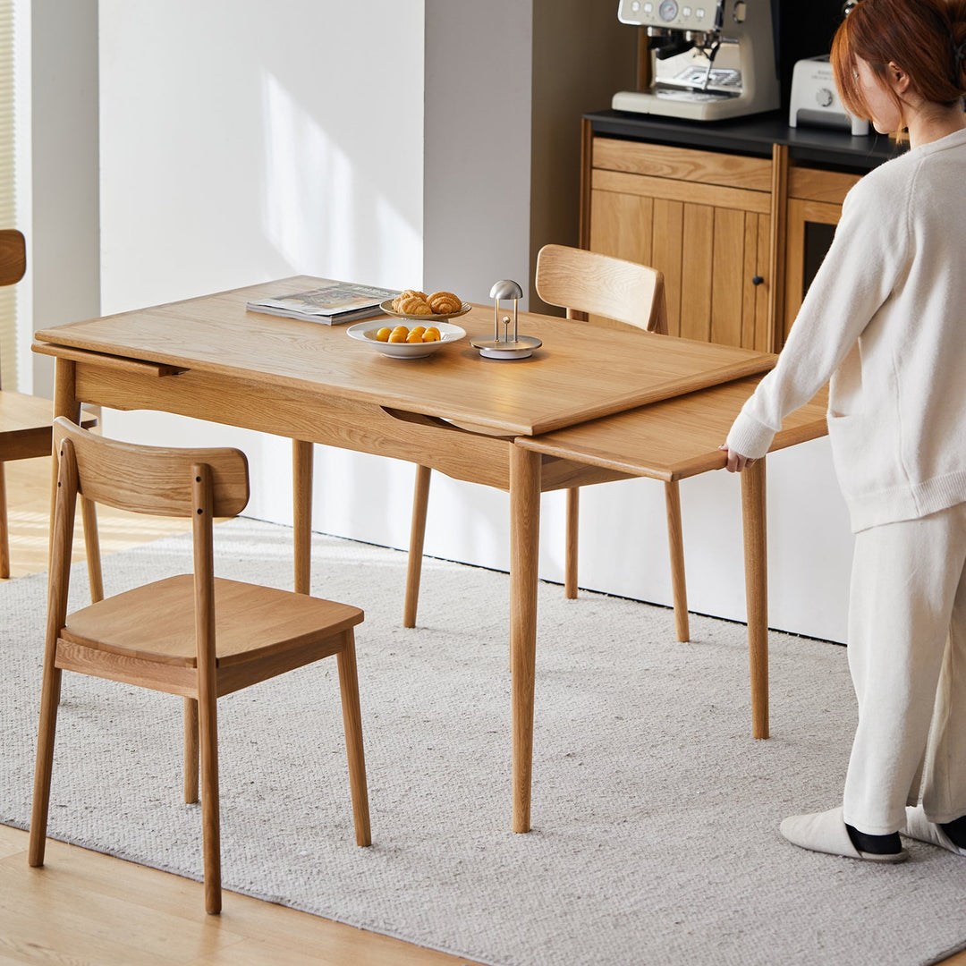 Scandinavian cherry wood extendable dining table mcgee in real life style.