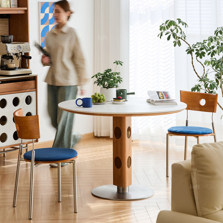 Scandinavian cherry wood sintered stone round dining table timeless with context.