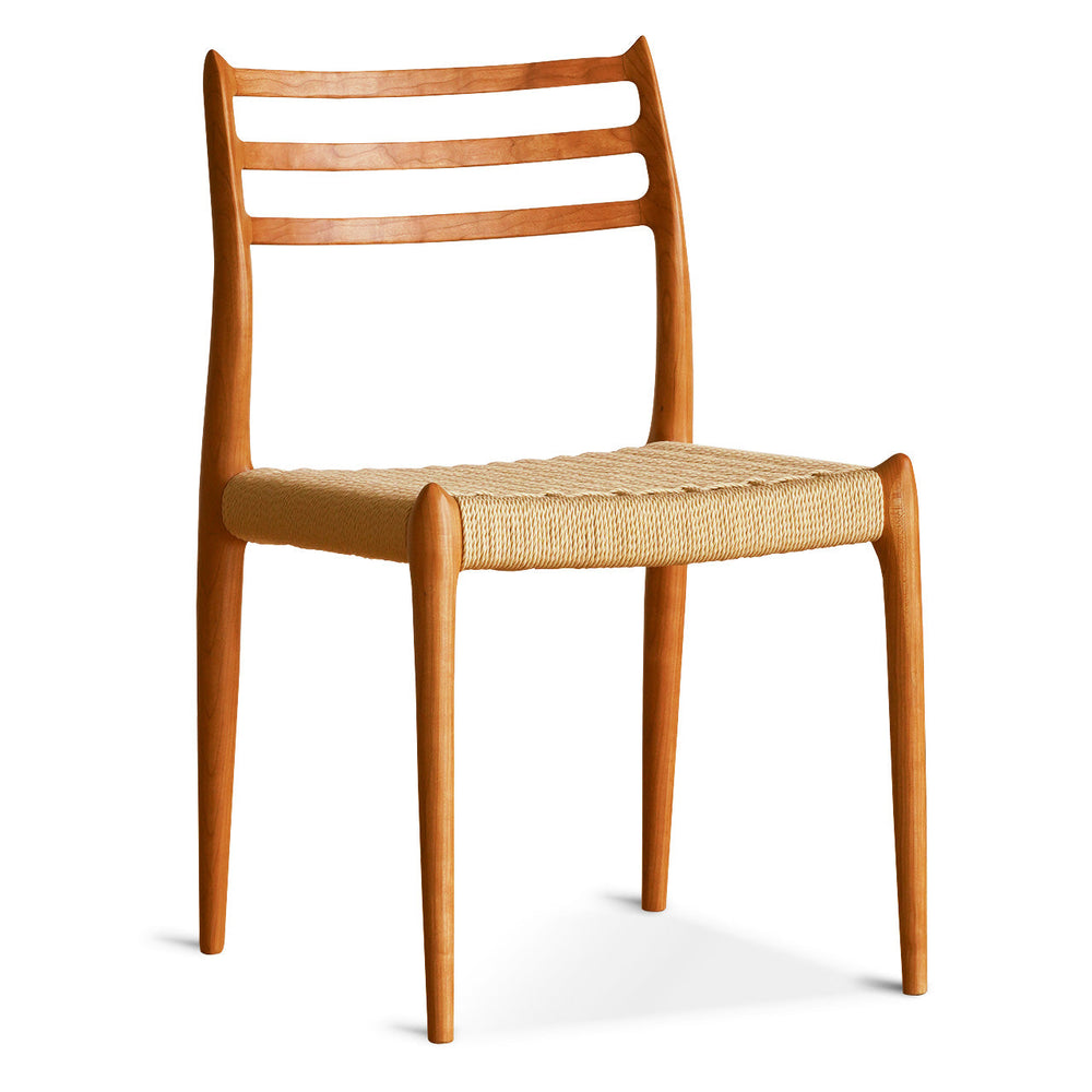Wooden chair with woven seat on a white background