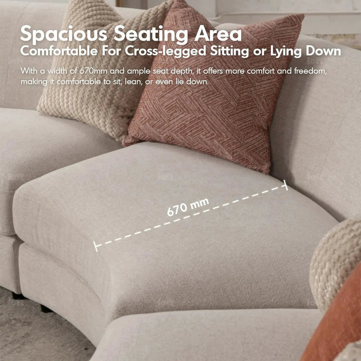 Cream fabric modular 5 seater sofa groove with context.
