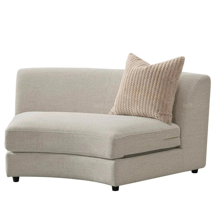 Cream fabric modular armless 1 seater sofa groove in panoramic view.