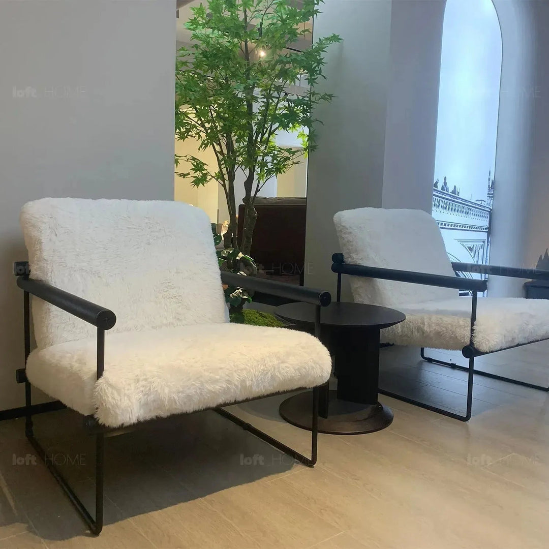 Cream sherpa fabric 1 seater sofa snowy with context.