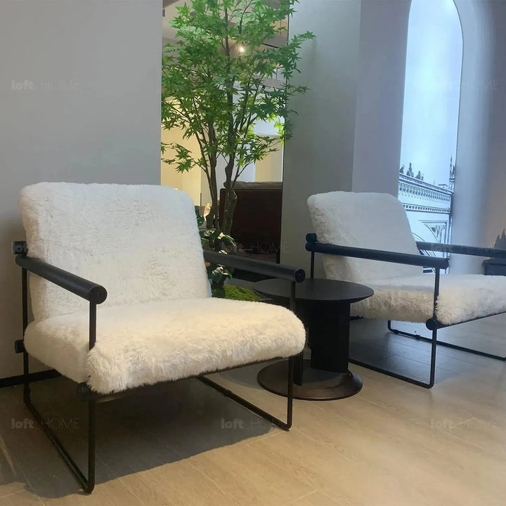Cream sherpa fabric 1 seater sofa snowy with context.