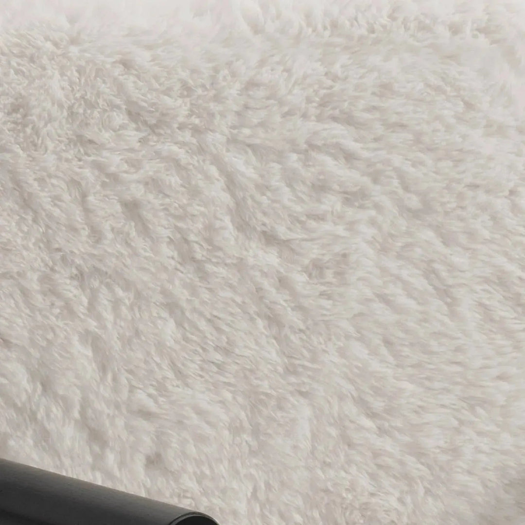 Cream sherpa fabric 1 seater sofa snowy in close up details.