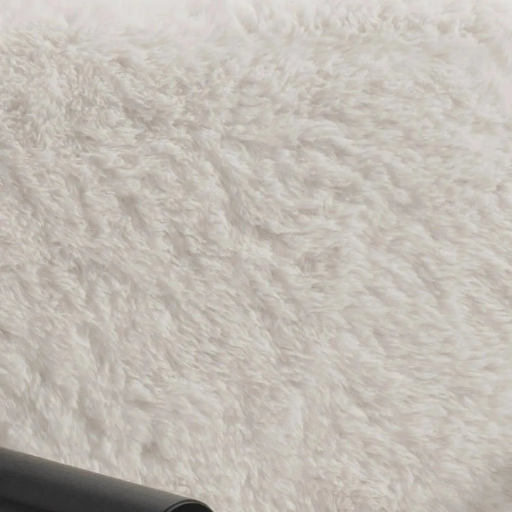 Cream sherpa fabric 1 seater sofa snowy in close up details.