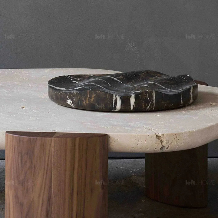 Scandinavian travertine stone coffee table trawo in close up details.