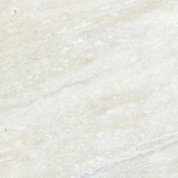 Scandinavian travertine stone side table trawo in close up details.