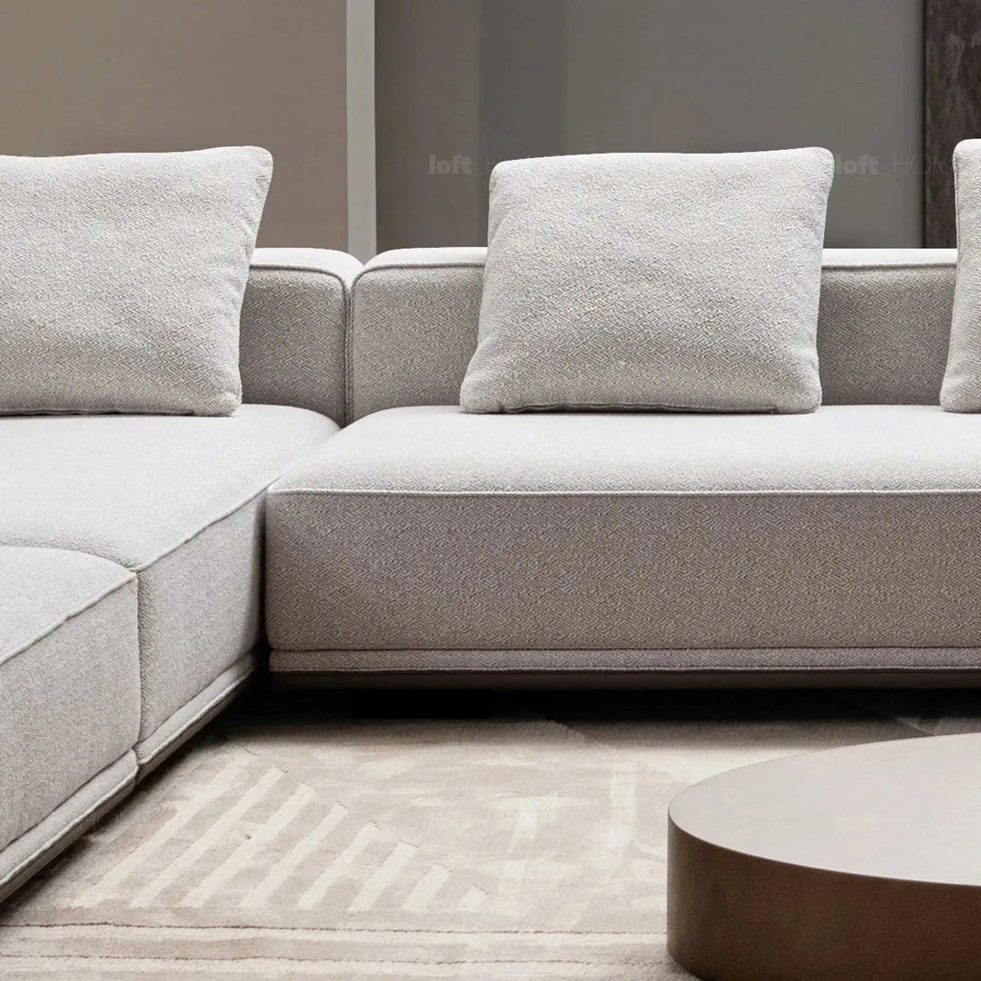 Minimalist mixed weave fabric modular ottoman eleganza l with context.